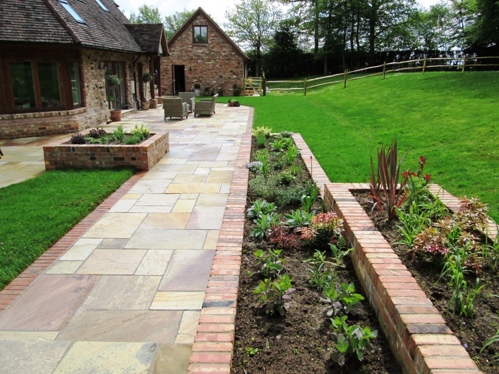 Garden with Reclaimed Brick Planters and Indian Sandstone Paving